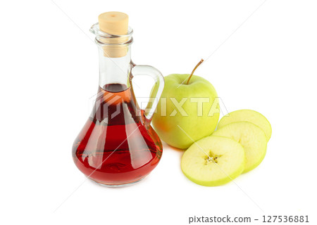 Apple vinegar in a bottle and fresh apples isolated on a white 127536881