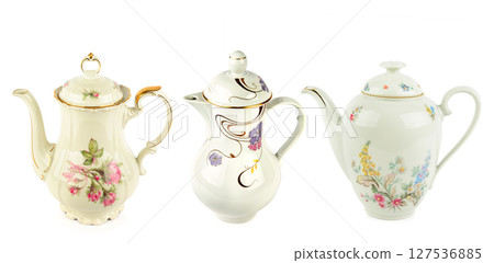 Elegant vintage porcelain coffee pots isolated on white background. Collage. Wide photo. Elegant vintage porcelain coffee pots isolated on white background. Collage. Wide photo. 127536885