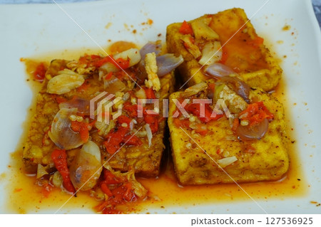 Pecak Tahu Tempe or Spicy fried tofu and tempeh with chili and shallots, a popular Indonesian dish. 127536925