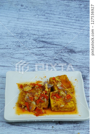 Pecak Tahu Tempe or Spicy fried tofu and tempeh with chili and shallots, a popular Indonesian dish. 127536927