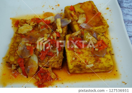 Pecak Tahu Tempe or Spicy fried tofu and tempeh with chili and shallots, a popular Indonesian dish. 127536931