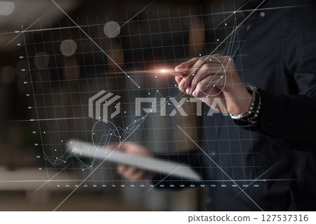 Pro analyzing data trends on screen. Pro analyzing data trends on screen. 127537316