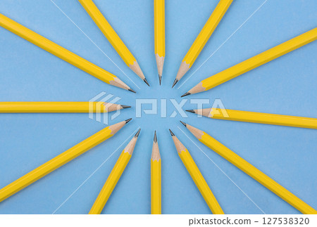 Yellow Pencils on Blue Background. Circular Layout. Stock photo. Yellow Pencils on Blue Background. Circular Layout. Stock photo. 127538320