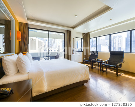 Hotel room overlooking the skyscrapers in downtown Bangkok, Thailand 127538350