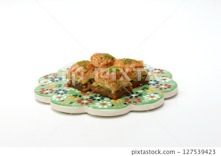 Turkish sweets baklava on white background Turkish sweets baklava on white background 127539423