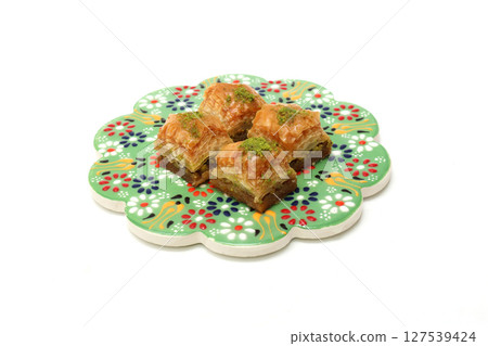 Turkish sweets baklava on white background Turkish sweets baklava on white background 127539424
