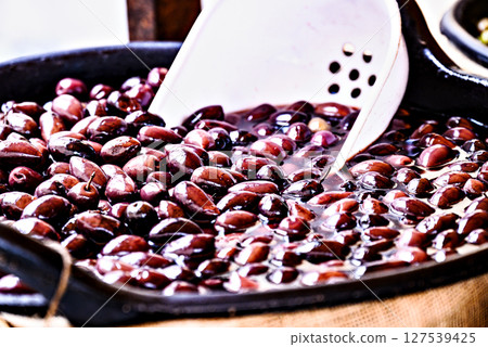 Bowl of fresh and delicious black olives. Bowl of fresh and delicious black olives. 127539425