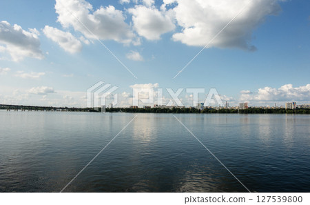 Panoramic view of the city of Dnepr. Ukraine. Reflection of the sky with clouds on the water surface. 127539800