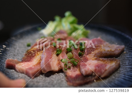 pieces of raw pork belly fresh raw slices Kurobuta pork with high-marbled texture on white plate isolated on white background. 127539819