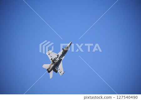 Hornet fighter jet performing acrobatic flying Hornet fighter jet performing acrobatic flying 127540490