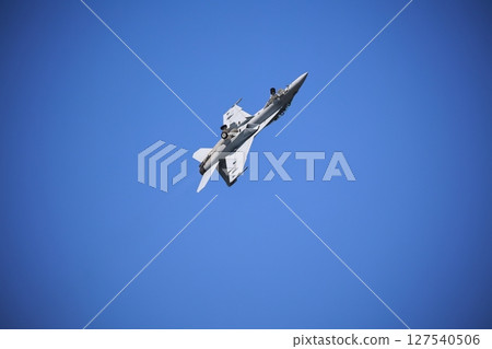Hornet fighter jet performing acrobatic flying Hornet fighter jet performing acrobatic flying 127540506