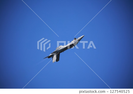 Hornet fighter jet performing acrobatic flying Hornet fighter jet performing acrobatic flying 127540525