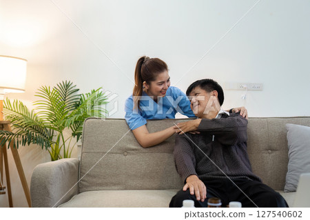 elderly touch hand on back of hand caregiver or nurses to express thankful 127540602