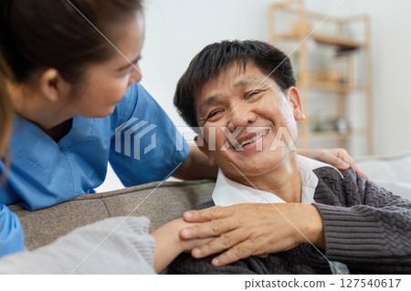elderly touch hand on back of hand caregiver or nurses to express thankful elderly touch hand on back of hand caregiver or nurses to express thankful 127540617