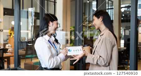 Business woman talking and brainstorming, discussion with colleague about strategy Business woman talking and brainstorming, discussion with colleague about strategy 127540910