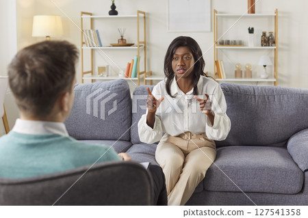 Therapist meeting, hr manager helpful in counseling beautiful African American woman, consulting Therapist meeting, hr manager helpful in counseling beautiful African American woman, consulting 127541358