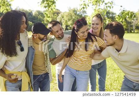 Happy Friends Embracing In City Park 127541459