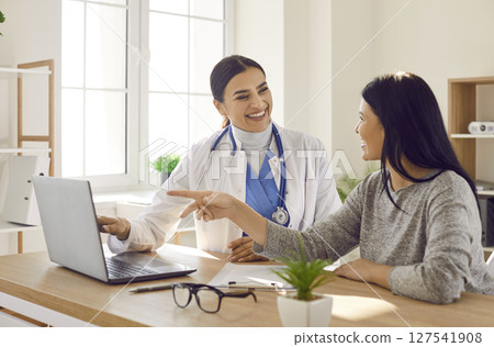 Female patient visiting a doctor at the medical office during medical examination. 127541908
