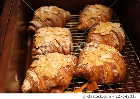 Almond croissants rack Homemade Almond Croissants freshly baked and cooling on rack 127542035