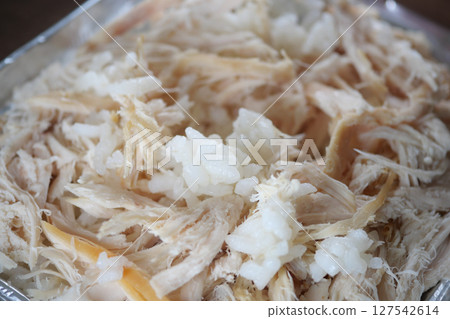 Shredded Chicken Served in a Stylish Metallic Tray for Your Enjoyment 127542614