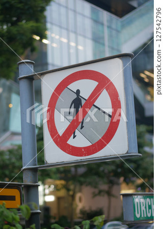 No pedestrian crossing sign in urban area No pedestrian crossing sign in urban area 127542796