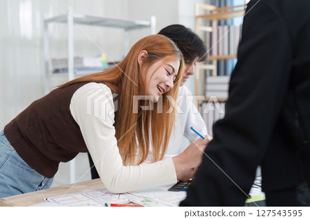 Close up ux developer and ui designer brainstorming interface wireframe design.Creative digital development agency 127543595