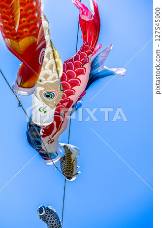 Carp streamer swimming in the blue sky 127545900