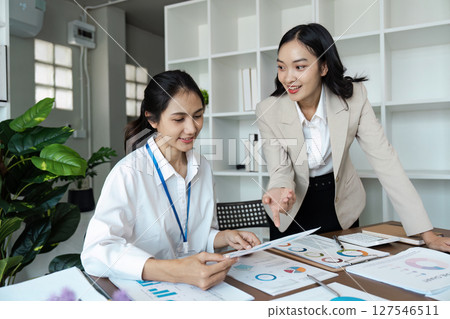 Business people discussing and brainstorming together in conference room during meeting at office. Strategy, Planning, Teamwork Business people discussing and brainstorming together in conference room during meeting at office. Strategy, Planning, Teamwork 127546511