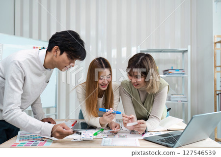 UI designer and UX developer brainstorm idea to design the application appearance in the early stage. Creative digital development agency. UX UI concept 127546539