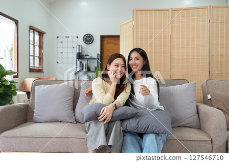 gay couple hug on sofa to relax together in healthy relationship love connection. Lgbtq couple concept 127546710
