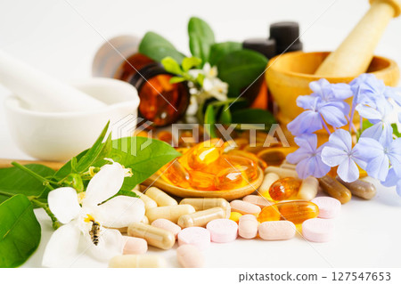 Alternative medicine herbal organic capsule with vitamin E omega 3 fish oil, mineral, drug with herbs leaf natural supplements for healthy good life. 127547653