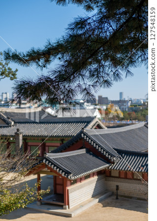 View of Traditional Korean Roof from above of Hwaseong Haenggung, temporary palace where the king used to stay when he traveled outside of Seoul, South Korea. It is famous as K-drama filming location. View of Traditional Korean Roof from above of Hwaseong Haenggung, temporary palace where the king used to stay when he traveled outside of Seoul, South Korea. It is famous as K-drama filming location. 127548159