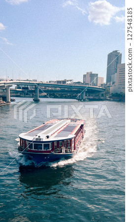 Water buses sailing on the river Water buses sailing on the river 127548185