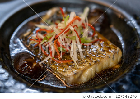 Streamed Seabass Fish with Soy Sauce served on plate Streamed Seabass Fish with Soy Sauce served on plate 127548270