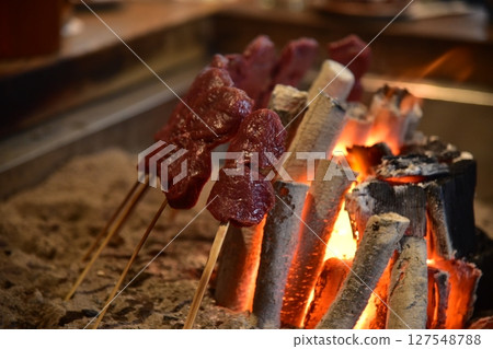 Meat grilled on the hearth 127548788
