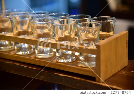 Shot glasses lined up Shot glasses lined up 127548794