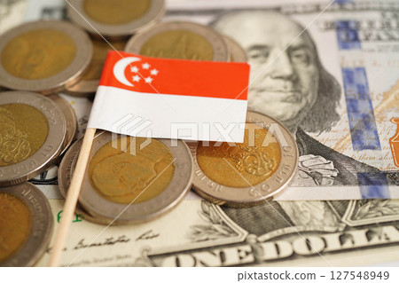 Singapore flag on coin and banknote money, finance trading investment business currency concept. 127548949
