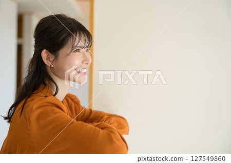 Profile of a Japanese woman staring at something 127549860