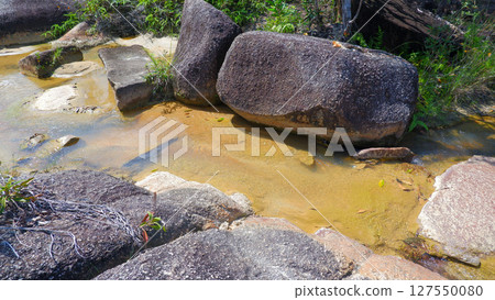 Smooth Granite Slope with Gradual Color Transition and Tropical Forest Edge 127550080