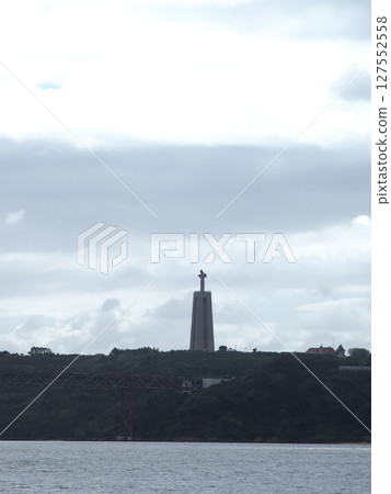 View of Cristo Rei statue from Belem Tower, Lisbon, Portugal, cloudy day in May View of Cristo Rei statue from Belem Tower, Lisbon, Portugal, cloudy day in May 127552558