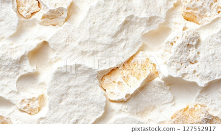 the image shows a close up view of a textured surface composed of irregular, interconnected rock like pieces 127552917