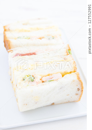 Shrimp and salmon rye sandwich 127552991