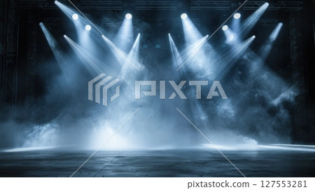 A dramatic scene showcasing a dark stage illuminated by bright spotlights, atmospheric performance setting 127553281