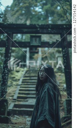 A woman standing in a torii 127554142