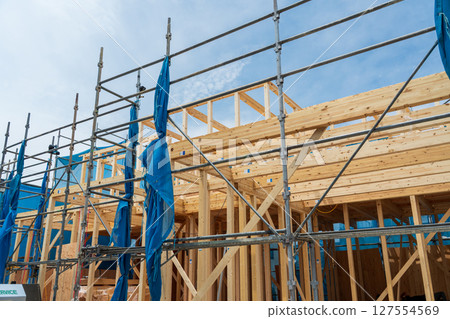 Building up a two-story wooden house Building up a two-story wooden house 127554569