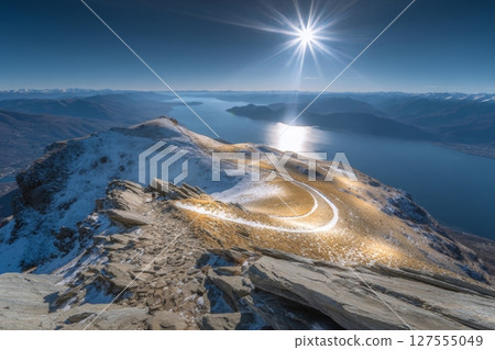 A hiking trip in the Italian mountains near Lake Como is underway for a woman visiting the areas of Lecco and Como 127555049