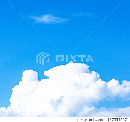 A simple summer scene with blue skies and white clouds 127555237