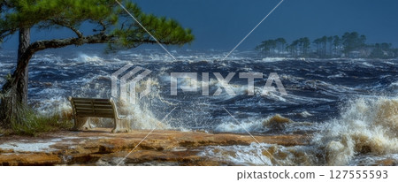 A bench on a sea beach in Kolobrzeg is flooded by storm waves 127555593