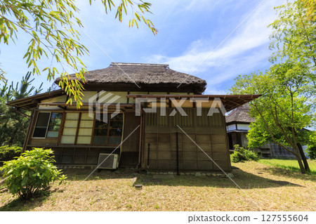 Summer of an old private house 127555604