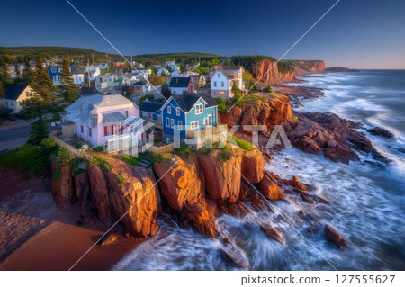 The coastline of Acadia National Park in Maine is rugged and bathed in early morning summer light 127555627